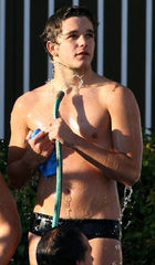 Hottie in Speedo cooling off with hose