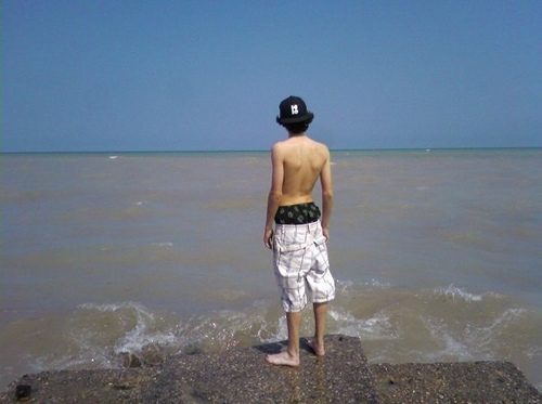 He watches the waves...