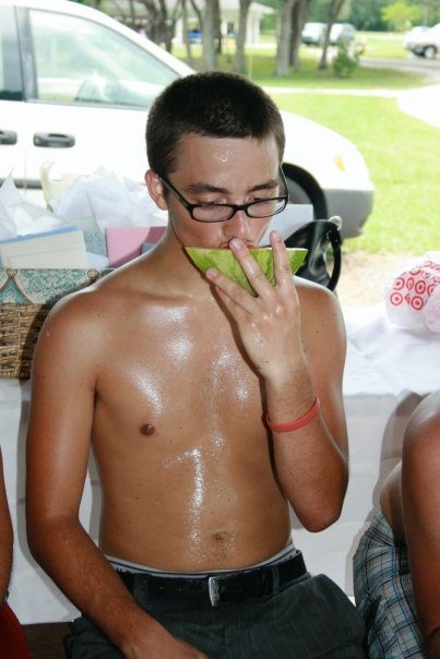 cute boy eating watermelon