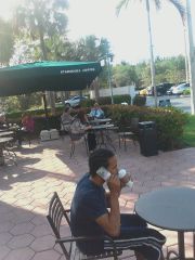 Sagging & Holding $250 In Hand Outside Of Starbucks While Drinking A Green Tea