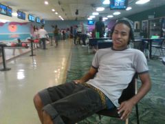 Sagging With A Leopard Skin Belt While Sitting Down In The Bowling Alley