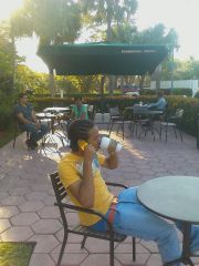 Sagging With A Hermes Orange Belt While Drinking Green Tea Outside Of Starbucks