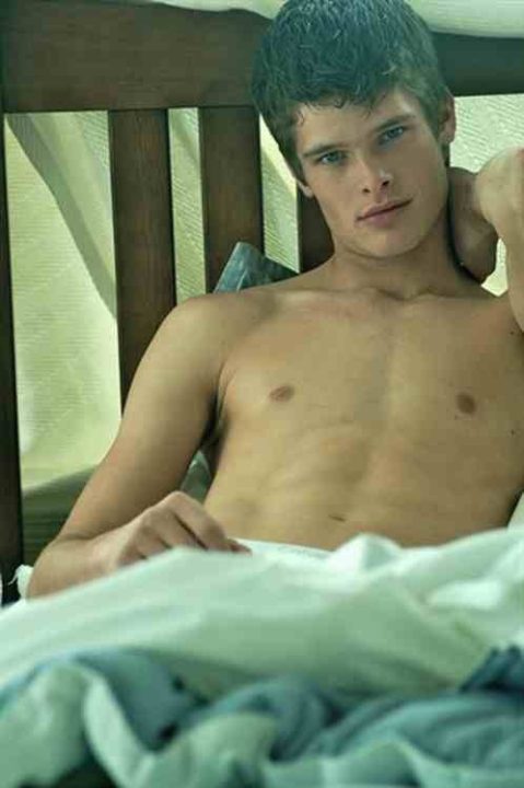 Hot shirtless lad in bed