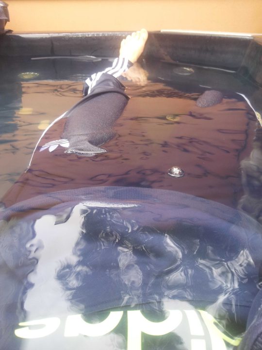 In the jacuzzi fully clothed in Adidas