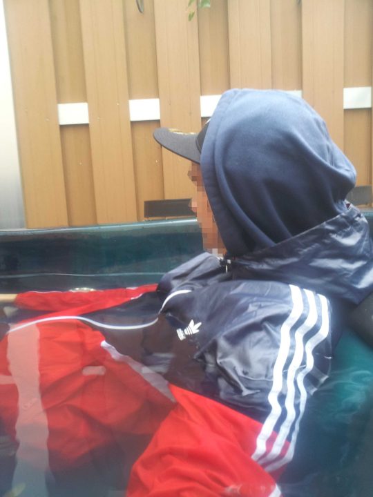 In the pool fully clothed