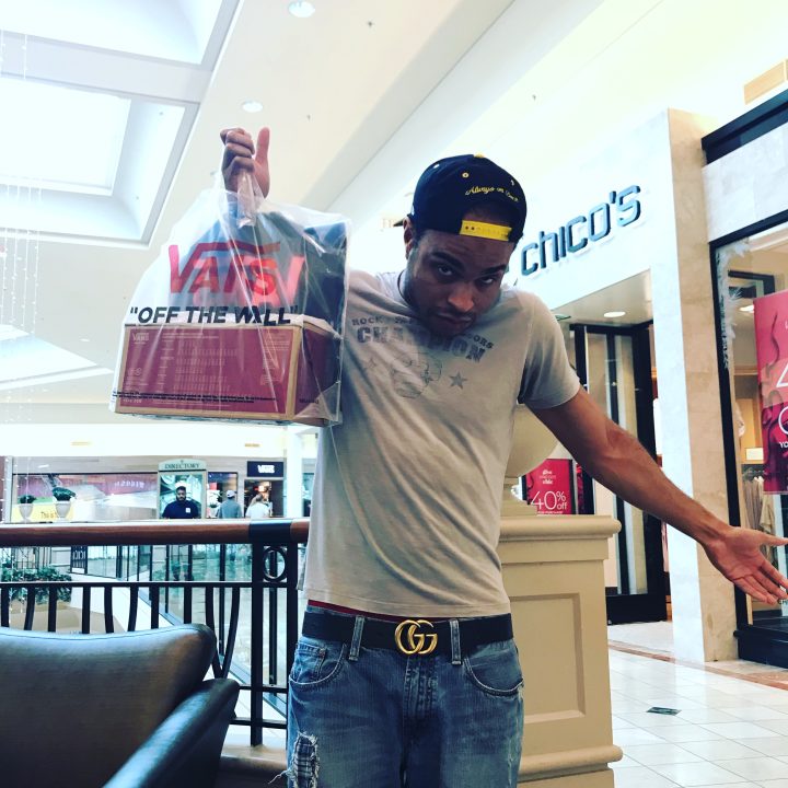 Leaving Vans Store with shopping bag!