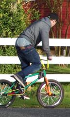 Sagging cyclist on rainbow bike.jpg