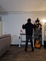Sagging in dark grey jeans